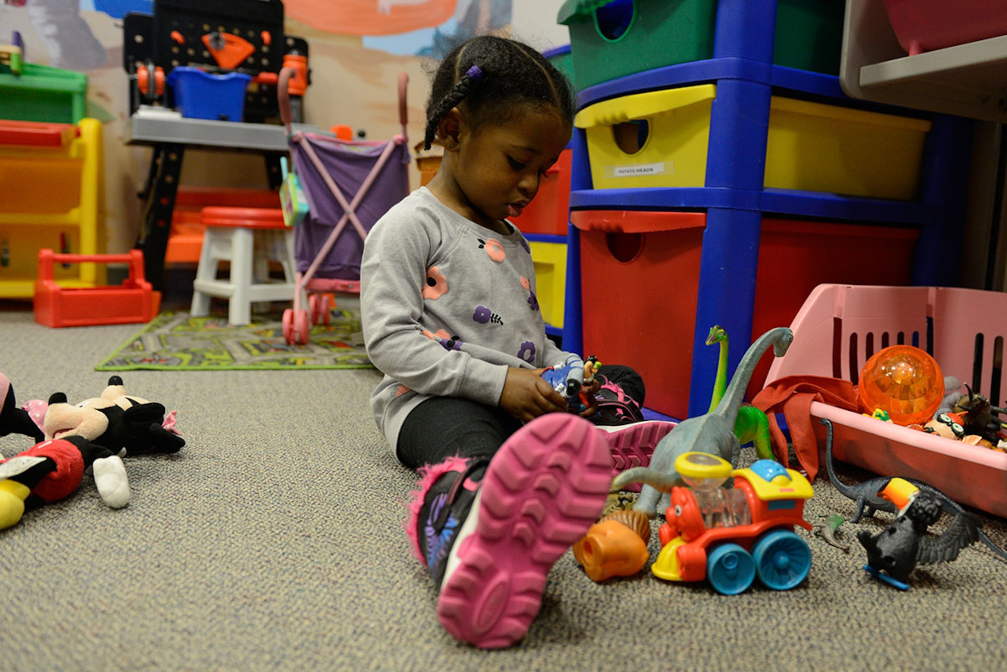 Olivia Powell, 2, plays at the Teddy’s Child Watch care center at Joint Base Elmendorf-Richardson, Dec. 9, 2015. Teddy’s Child Watch is a free child care service for children ages six weeks to 12 years old. Olivia is the daughter of Damian Powell, with the 673d Surgical Operations Squadron, and Tanisha Powell. (U.S. Air Force photo by Airman Valerie Monroy)