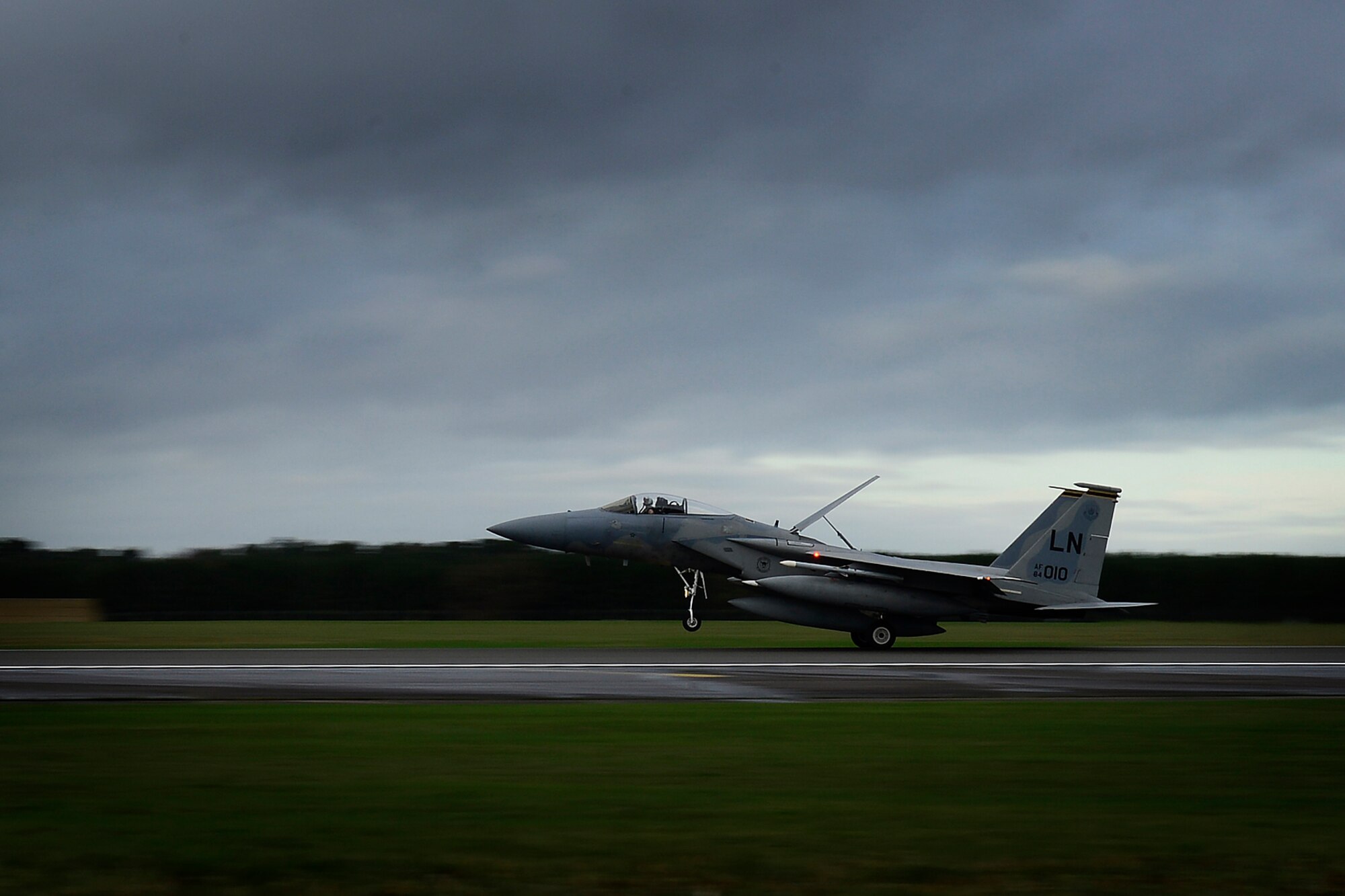 A U.S. Air Force F-15C Eagle lands at Royal Air Force Lakenheath, England, after a deployment to Incirlik Air Base, Turkey, Dec. 16, 2015. Six F-15Cs from the 48th Fighter Wing deployed to Incirlik to conduct training and operational missions supporting Turkish allies and their sovereign airspace. As an air-to-air fighter aircraft, the F-15C specializes in gaining and maintaining air superiority. (U.S. Air Force photo/Airman 1st Class Erin R. Babis)