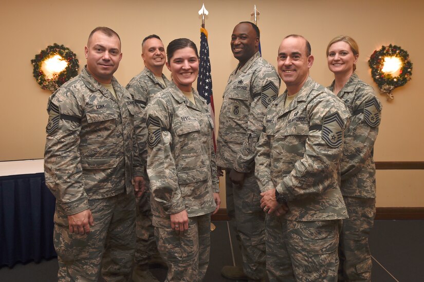Six of the nine Joint Base Andrews’ Senior Master Sgts. selected for promotion to Chief Master Sgt. pose for a photo during a release ceremony held at The Club here, Dec. 17, 2015. Congratulations to Stacy Ascione, Robert Kamholz, Timothy Leahey, Dana Council, Jodi Epps, Alexander Garrett, Angel Luna, Marjon Robertson and James Worley. (U.S. Air Force photo/Senior Airman Ryan J. Sonnier)