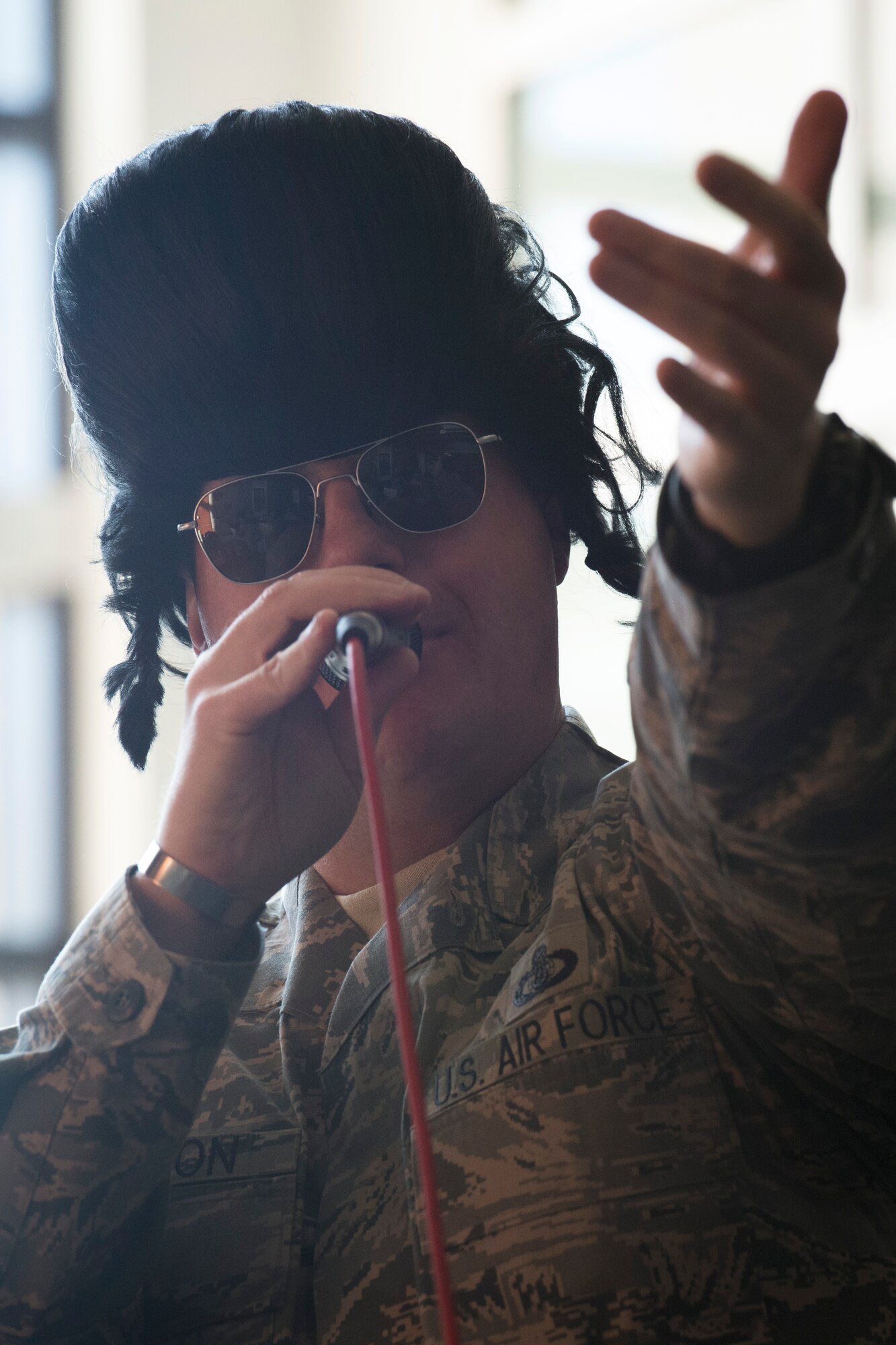 Senior Master Sgt. Ryan Carson, U.S. Air Force Band’s Max Impact vocalist, sings holiday carols in the lobby of the William A. Jones III building at Joint Base Andrews, Md., Dec. 16, 2015. Max Impact featured Elvis Presley’s “Blue Christmas” during a surprise performance in the Jones building. (U.S. Air Force photo by Airman 1st Class Philip Bryant/Released)