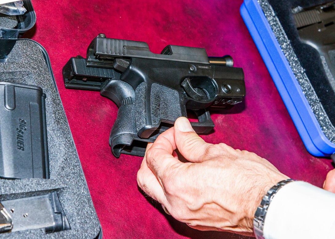 A Sig Sauer P290RS, above, and a Glock 43 were two of 10 weapons on display Dec. 10 at Air Force Office of Special Investigations headquarters to showcase some of the options available to Special Agents who want to carry a privately owned weapon in accordance with new OSI Weapons Program policy guidance. (U.S. Air Force photo by Michael Hastings)  