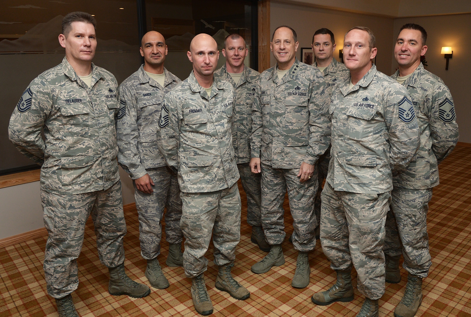 Air Force Sustainment Center Commander Lt. Gen. Lee Levy II congratulates Team Hill's newest chief master sergeant-selects Dec.17. (U.S. Air Force photo/Alex R. Lloyd)
