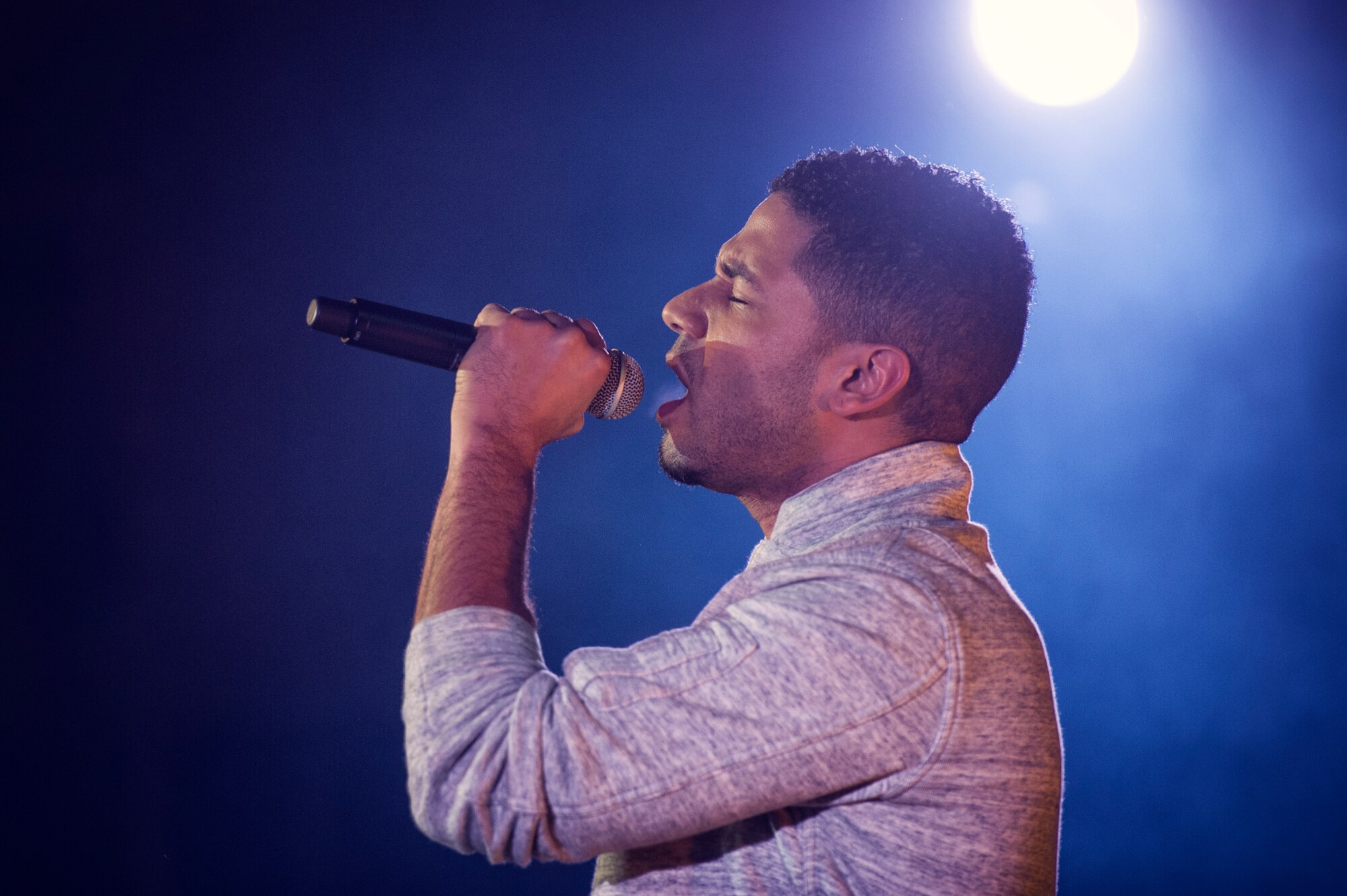 Jussie Smollett, known for his role as Jamal Lyon on the television series Empire, performs at Yokota Air Base, Japan, Dec. 15, 2015. As part of the United Service Organizations Empire tour, cast members participated in meet and greets, spoke with Yokota High School youth and hosted and performed a family-friendly White Party. Smollett said that the tour was a great opportunity for him to give back and share thanks to service members. (U.S. Air Force photo by Airman 1st Class Delano Scott/Released)