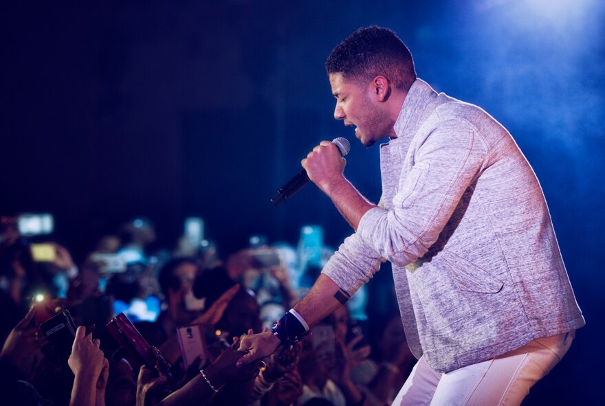 Jussie Smollett, known for his role as Jamal Lyon on the television series Empire, performs at Yokota Air Base, Japan, Dec. 15, 2015. As part of the United Service Organizations Empire tour, cast members participated in meet and greets, spoke with Yokota High School youth and hosted and performed a family-friendly White Party. Smollett said that the tour was a great opportunity for him to give back and share thanks to service members. (U.S. Air Force photo by Airman 1st Class Delano Scott/Released)