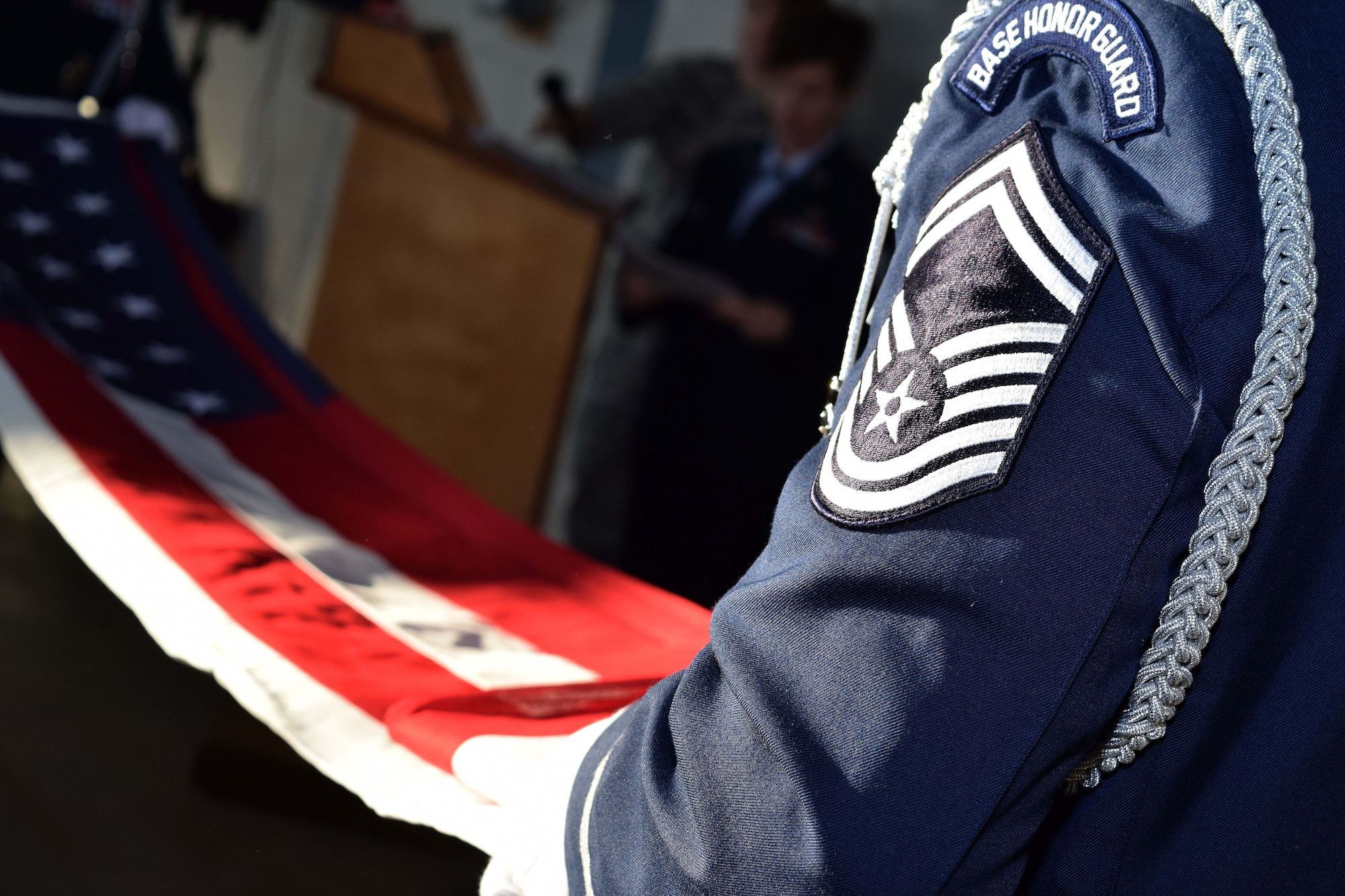 Members of the 111th Attack Wing Honor methodically fold the American flag during a retirement ceremony for Chief Master Sgt. Stephen Rossi, vehicle maintenance superintendent with the 201st RED HORSE, Det. 1, at the Horsham Air Guard Station, Pennsylvania, Dec. 5, 2015. Rossi was presented the flag as he prepares to retire from the Wing after nearly four decades of service to the Pennsylvania National Guard. (U.S. Air National Guard photo by Master Sgt. Christopher Botzum/Released)