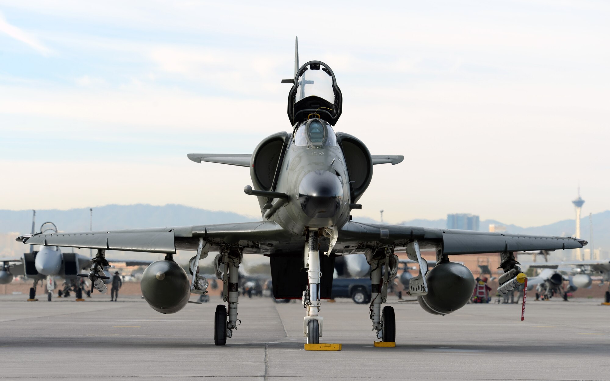 A Draken International A-4 Skyhawk parks on the Nellis Air Force Base, Nev., flightline awaiting preflight check on Dec. 3, 2015. Draken is used to support various types of military training objectives around the globe. (U.S. Air Force photo by Airman 1st Class Rachel Loftis)