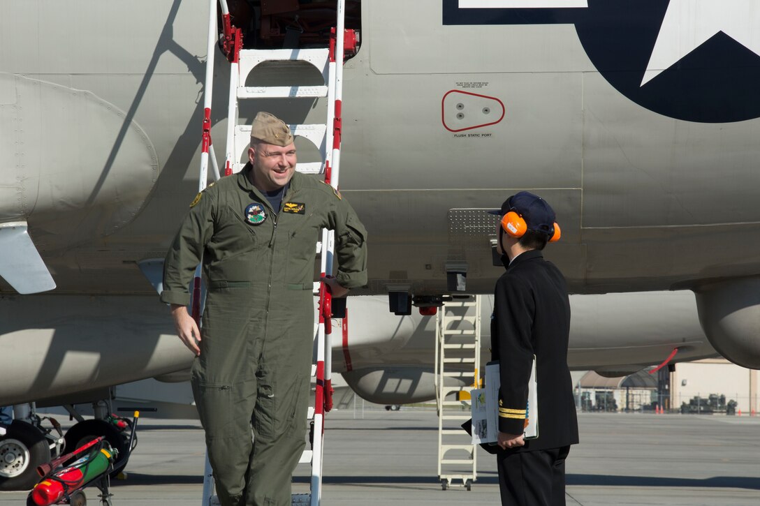 U.S. Navy Lt. Cmdr. Justin Gerle, officer in charge of Commander Task Group 72.5, Fleet Air Reconnaissance Squadron VQ-1, arrives at Marine Corps Air Station Iwakuni, Japan, Dec. 8, 2015. Members of VQ-1 met with Air Reconnaissance Squadron VQ-81 with the Japan Maritime Self-Defense Force on the air station as a part of an annual unit exchange program between the naval unit and their sister unit in the JMSDF.