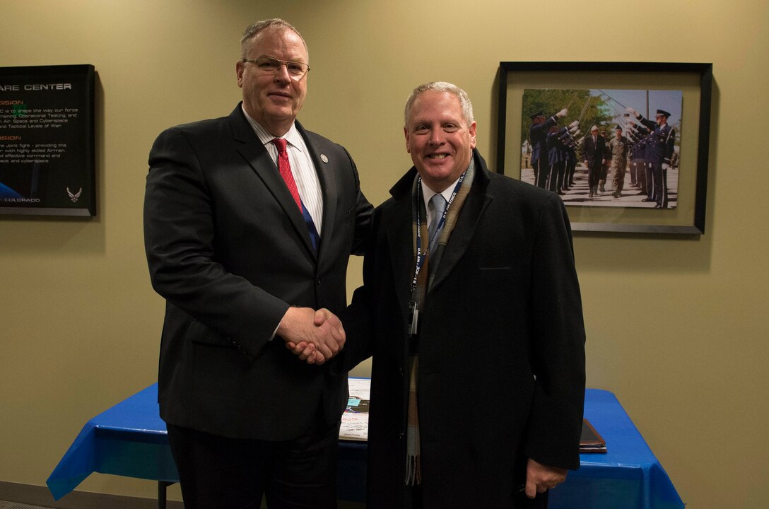 Deputy Defense Secretary Bob Work stands for a photo with Jason Altcheck, Schriever Wargame director, on Schriever Air Force Base, Colo., Dec. 17, 2015. DoD photo by Navy Petty Officer 1st Class Tim D. Godbee