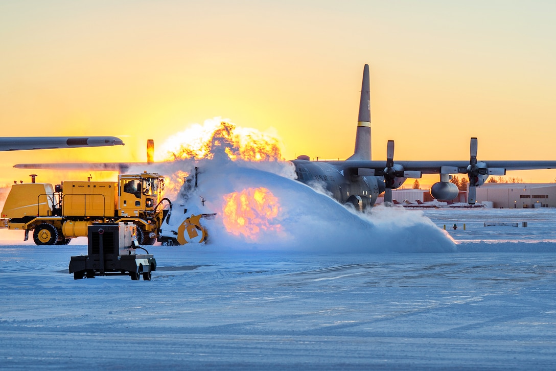 A snow plow removes snow in front of a Wyoming Air National Guard C-130H Hercules aircraft in Cheyenne, Wyo., Dec. 16, 2015. The National Weather Service reported more than inches of snow at Cheyenne Regional Airport Dec. 15, which broke the old record of 3.3 inches set in 1892. The aircraft is assigned to the 153rd Airlift Wing. Wyoming National Guard photo by Air Force Master Sgt. Charles Delano