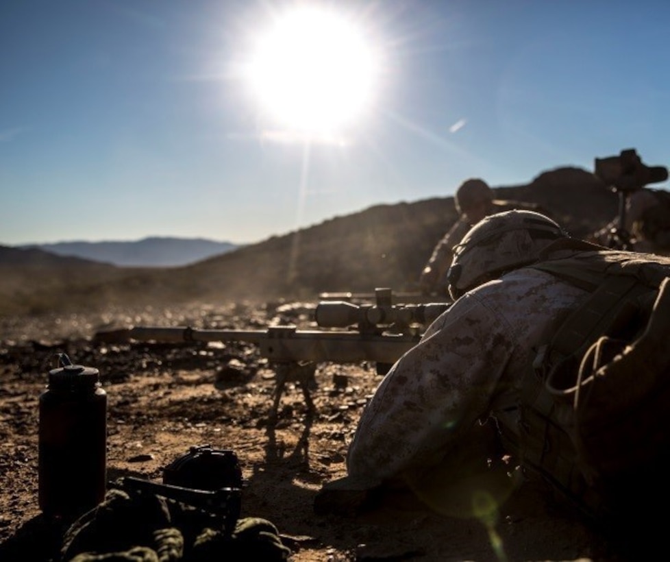 Marines with 1st Battalion, 8th Marine Regiment fire simultaneously during the sniper marksmanship assessment as part of Integrated Training Exercise 1-16 aboard Marine Air Ground Combat Center, Twentynine Palms, Calif., Oct. 24, 2015. During ITX, Marines demonstrate core, infantry mission essential tasks while conducting offensive and defensive stability operations. (U.S. Marine Corps photo by Cpl. Immanuel M. Johnson/Released)