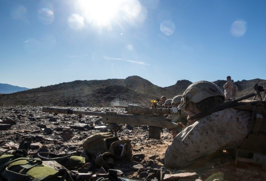 Marines with 1st Battalion, 8th Marine Regiment await for the command to engage man-size targets during the sniper marksmanship assessment as part of Integrated Training Exercise 1-16 aboard Marine Air Ground Combat Center, Twentynine Palms, Calif., Oct. 24, 2015. During ITX, Marines demonstrate core infantry mission essential tasks while conducting offensive and defensive stability operations. (U.S. Marine Corps photo by Cpl. Immanuel M. Johnson/Released)