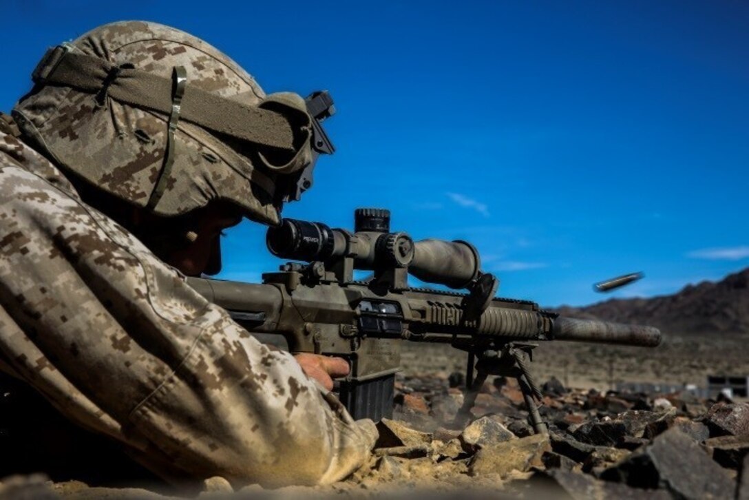 A Marine with 1st Battalion, 8th Marine Regiment fires at a target at an unknown distance drill during the sniper marksmanship assessment as part of Integrated Training Exercise 1-16 aboard Marine Air Ground Combat Center, Twentynine Palms, Calif., Oct. 24, 2015. During ITX, Marines demonstrate core infantry mission essential tasks while conducting offensive and defensive stability operations. (U.S. Marine Corps photo by Cpl. Immanuel M. Johnson/Released)