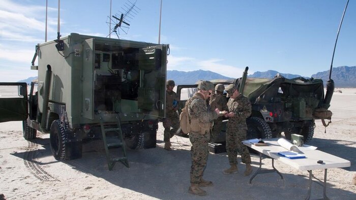 High Mobility Artillery Rocket System crewmen assigned to Battery D, 2nd Battalion, 14th Marine Regiment, prepare their launcher for live-fire operations after debarking a KC-130J aircraft, supporting their raid operations at White Sands Missile Range, New Mexico, Dec. 4, 2015. “We were essentially trying to test the capability of the HIMARS to launch an air raid from any position,” said Sgt. Garrett S. Zurich, HIMARS launcher section chief, 1st platoon, Battery D.