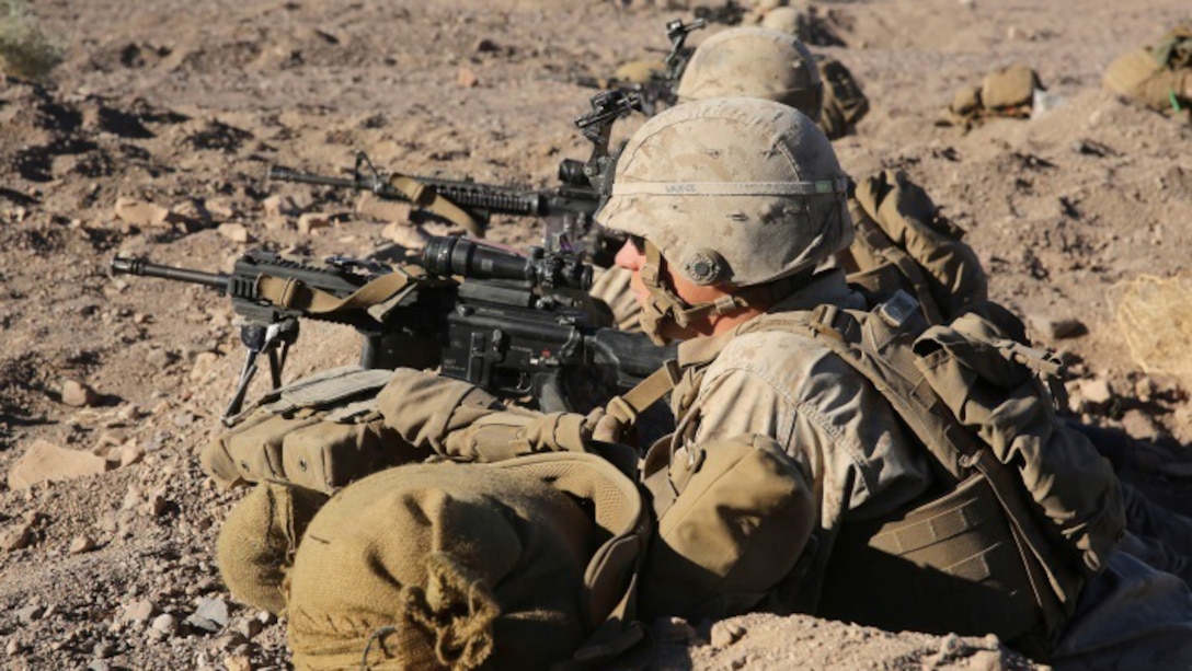 Marines with Charlie Company, 1st Battalion, 8th Marine Regiment await confirmation to fire during the counterattack of the Battalion Assault Course, the culminating event for Integrated Training Exercise 1-16 aboard Marine Corps Air Ground Combat Center, Twentynine Palms, Calif., Nov. 6, 2015. The BAC assessed a battalion’s ability to conduct offensive and defensive operations integrating elements from the Air Combat Element and Logistics Combat Element. 