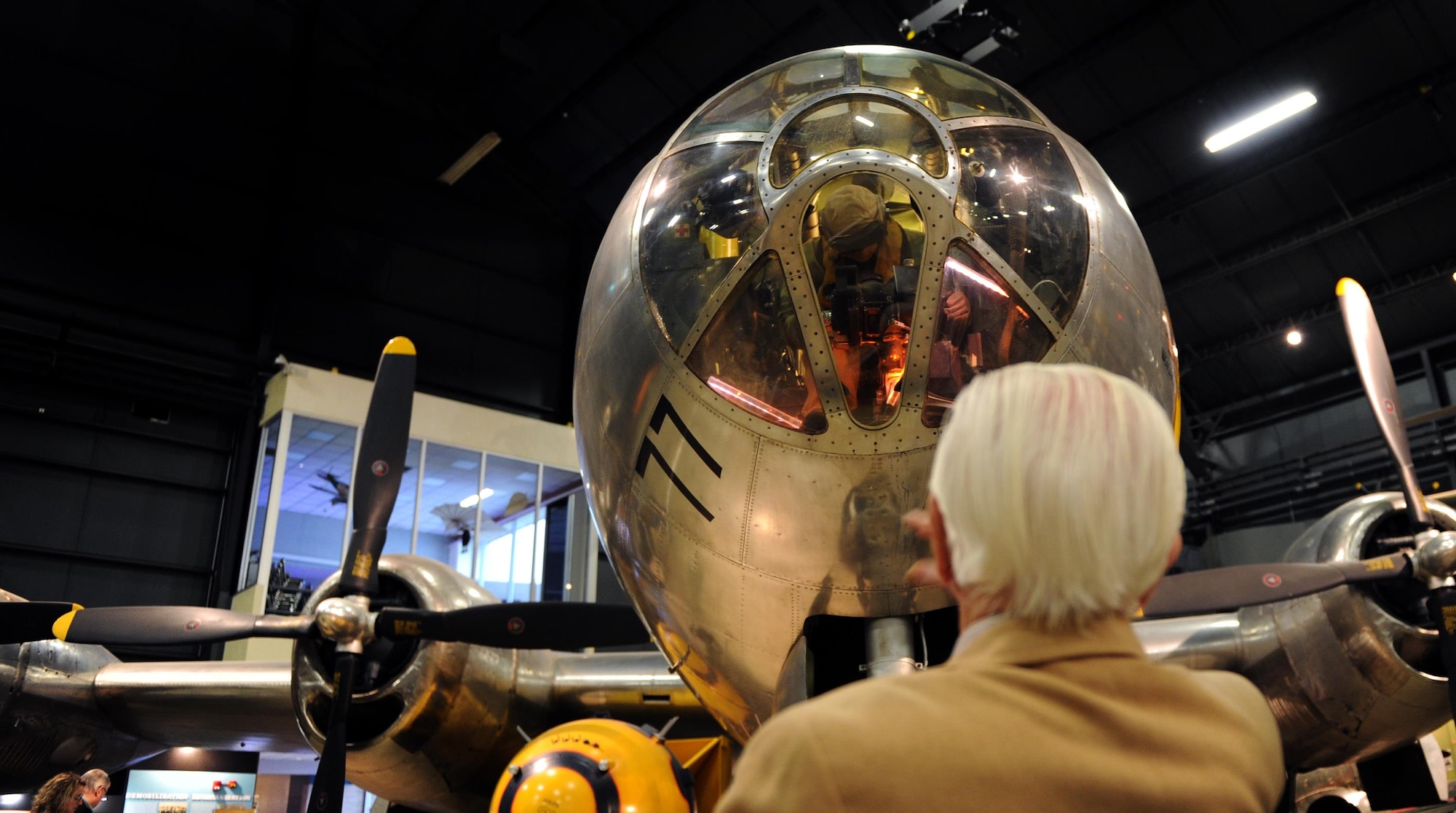 Victor Bilek, a retired National Air and Space Intelligence Center Airman, stares up at a B-29 Superfortress  Wednesday, Dec. 9, 2015 at the National Air Force Museum. He worked on experimental armament for the airplane during WWII. As a non-rated officer, he had more flying hours in the plane than any other person on Wright Field at the time. At 97 years old, Bilek is the oldest living NASIC alum. He recently came to the Center to share his war stories with today's generation of Airmen. (U.S. Air Force photo by Tech. Sgt. Raymond Hoy)