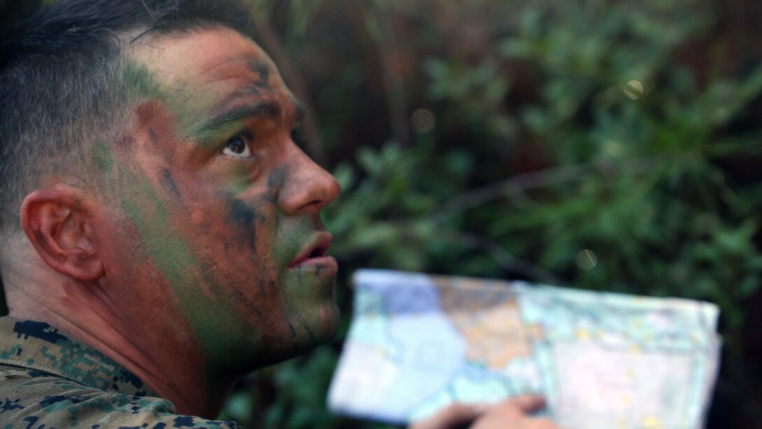 Staff Sgt. Steven Lawson, a chief scout with 2nd Light Armored Reconnaissance Battalion, gives out coordinates to platoons during a patrolling exercise at Marine Corps Base Camp Lejeune, N.C., Dec 15, 2015. The unit practiced patrolling techniques and set up patrol bases to maintain readiness. 
