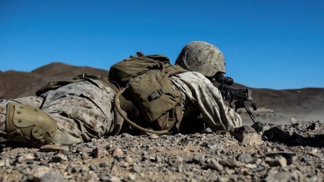 A Marine with Alpha Company, 1st Battalion, 8th Marine Regiment fires downrange while maintaining contact with Marines to his right during Integrated Training Exercise 1-16 aboard Marine Air Ground Combat Center, Twentynine Palms, Calif., Oct. 26, 2015. During ITX, Marines demonstrate core infantry mission essential tasks while conducting offensive and defensive stability operations. 