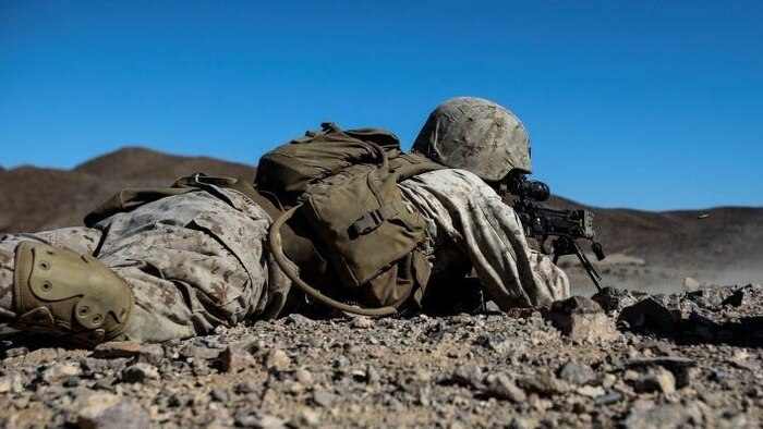 A Marine with Alpha Company, 1st Battalion, 8th Marine Regiment fires downrange while maintaining contact with Marines to his right during Integrated Training Exercise 1-16 aboard Marine Air Ground Combat Center, Twentynine Palms, Calif., Oct. 26, 2015. During ITX, Marines demonstrate core infantry mission essential tasks while conducting offensive and defensive stability operations. 