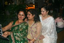 Kanchana, from Nepal, Saima, from Pakistan, and Namrata, from India--all spouses of foreign officers attending Marine Corps University--pose for a selfie at the Civilian Military Council evening social for the fourth quarter on Dec. 10 in Woodbridge, Va. 