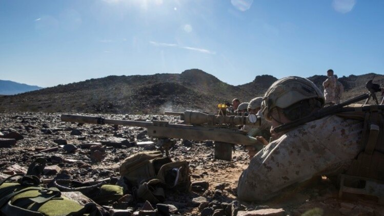Marines with 1st Battalion, 8th Marine Regiment await for the command to engage man-size targets during the sniper marksmanship assessment as part of Integrated Training Exercise 1-16 at Marine Corps Air Ground Combat Center, Twentynine Palms, Calif., Oct. 24, 2015. During ITX, Marines demonstrate core infantry mission essential tasks while conducting offensive and defensive stability operations