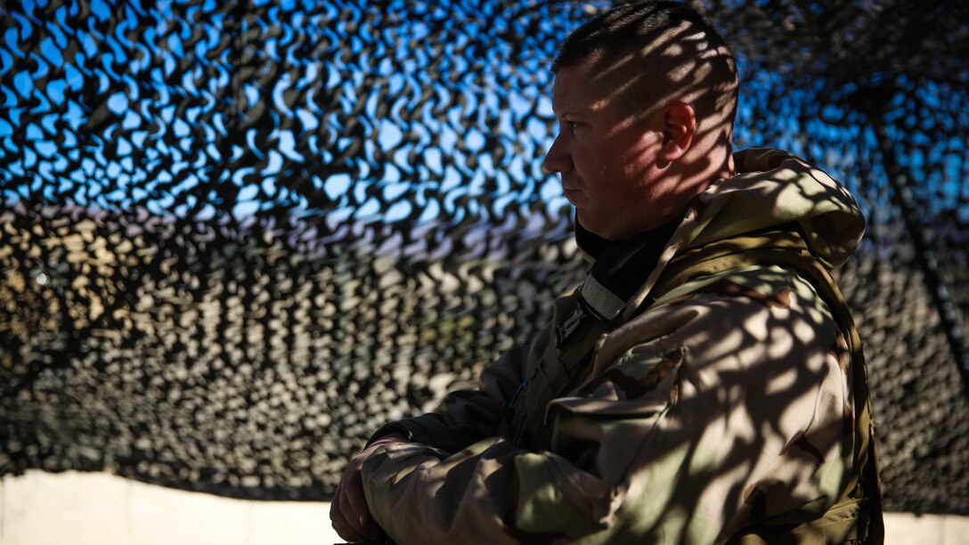 Major Richard Owen, a civil affairs officer with 5th Marine Regiment, 1st Marine Division, observes the entry control point during a chemical, biological, radiological, nuclear drill which was designed to familiarize the Marines with immediate actions aboard Marine Corps Air Ground Combat Center Twentynine Palms, Calif., Dec. 13, 2015. The Marines and Sailors with 5th Marine Regiment conducted the gas drill as part of Steel Knight 2016, a division-led exercise which prepares Marines and Sailors with the 1st Marine Division and adjacent I Marine Expeditionary Force units with the skill sets necessary to operate as a fully capable Marine Air Ground Task Force. 