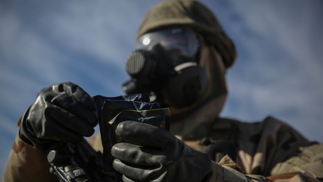 Gunnery Sgt. Apollo Thomas, the Chemical, Biological, Radiological, Nuclear defense chief holds tablets to test the air for harmful chemical agents during a CBRN drill aboard Marine Corps Air Ground Combat Center Twentynine Palms, California, Dec. 13, 2015. The Marines and Sailors with 5th Marine Regiment conducted the gas drill as part of Steel Knight 2016, a division-led exercise which prepares Marines and Sailors with the 1st Marine Division and adjacent I Marine Expeditionary Force units with the skill sets necessary to operate as a fully capable Marine Air Ground Task Force.  