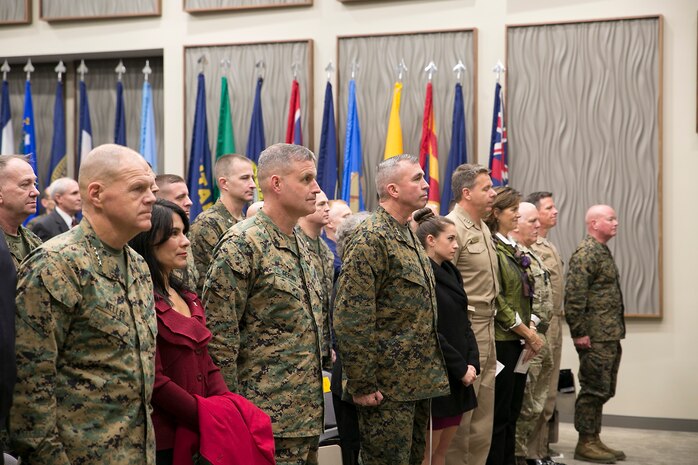 (first three U.S. Marines from left to right) Gen. Robert B. Neller, 37th commandant of the U.S. Marine Corps, Brig. Gen. Bradford J. Gering, outgoing commander of U. S. Marine Corps Forces Command and Fleet Marine Force Atlantic, Lt. Gen. John E. Wissler, incoming commander of U. S. Marine Corps Forces Command and Fleet Marine Force Atlantic, Adm. Phil Davidson, commander of U. S. Fleet Forces Command, and (far right) Maj. Gen. Walter Lee Miller Jr., commanding general of II Marine Expeditionary Force, stand at attention for the playing of the national anthem during an assumption-of-command ceremony on Dec. 18, 2015, in Norfolk, Va.