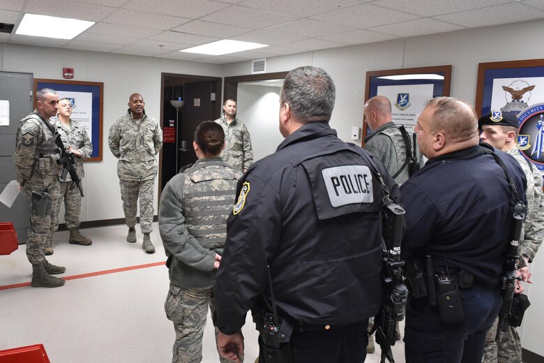 Chief Master Sgt. Cameron Kirksey, command chief of Air Force Reserve Command, answers questions from members of the 910th Security Forces Squadron during shift change here Dec. 6, 2015. Kirksey visited with 910th units over the December training weekend to address concerns of enlisted personnel as well as to assess the overall morale of the enlisted ranks serving on the base. (U.S. Air Force photo/Tech. Sgt. James Brock)