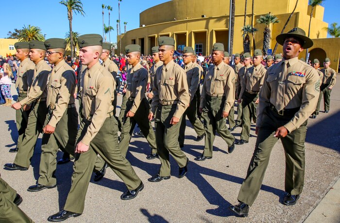 Marines from Alpha Company, 1st Recruit Training Battalion, march to meet families and friends prior to beginning liberty call at Marine Corps Recruit Depot San Diego, Dec. 17. Family Day allows the new Marines to reunite with families for the first time since leaving for Marine Corps recruit training. Today, all males recruited from west of the Mississippi are trained at MCRD San Diego. The depot is responsible for training more than 16,000 recruits annually. Alpha Company will graduate Dec. 18.