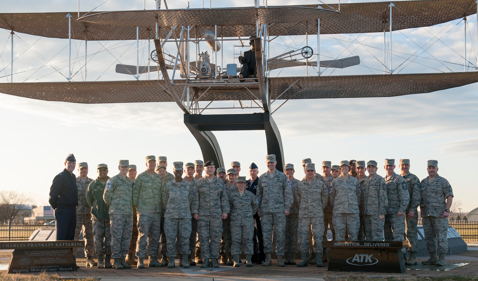 A group of new chief master sergeant selects pose for a group photo with Col. John Devillier, the 88th Air Base Wing commander, and the existing chief master sergeants at Wright-Patterson Air Force Base Thursday, Dec. 17, 2015 here. By congressional mandate, only 1 percent of the enlisted force obtains the rank of chief. (U.S Air Force photo by Senior Airman Samuel Earick)
