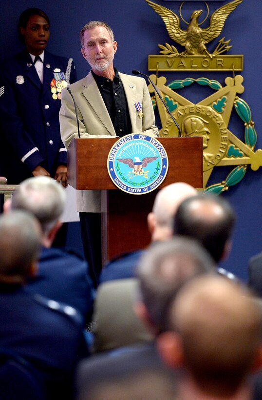 Air Force Chief of Staff Gen. Mark A. Welsh III presents the Silver Star to retired Chief Master Sgt. Ronald W. Brodeur and Eric L. Roberts II during a ceremony at the Pentagon in Washington D.C., Dec. 17, 2015. Brodeur and Roberts received their medals for their gallant action in Vietnam. (U.S. Air Force photo/Scott M. Ash)