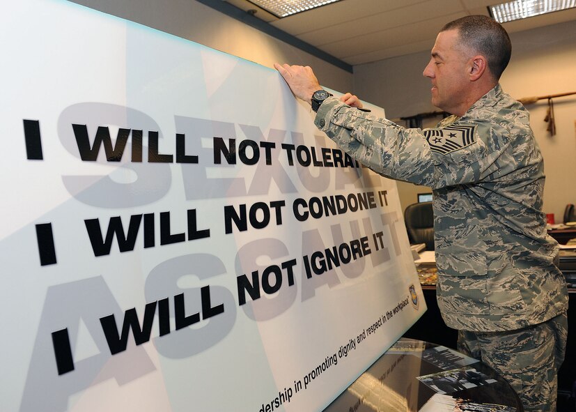 Chief Master Sgt. Troy Eden, National Air and Space Intelligence Center command chief, signs the center’s Sexual Assault Prevention and Response pledge board to mark the annual kickoff of SAPR Awareness Month. This year's theme, "Eliminate Sexual Assault: Know Your Part. Do Your Part.," is meant to remind service members that they all have a responsibility to prevent sexual assault, and support the survivors of these crimes. (U.S. Air Force photo by Tech. Sgt. Eunique P. Thomas)