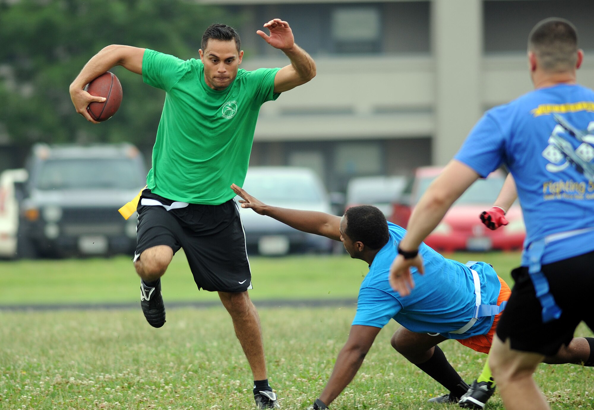 NASIC Airmen play flag football during the annual Sports Day competition Friday, June 26, 2015 on Wright-Patterson Air Force Base. The Center’s different groups competed in various sports throughout the day, including kickball, volleyball, football, soccer and races. The NASIC Space and Missiles Group took home the Commander’s Cup for the day. (U.S. Air Force photo by Tech. Sgt. Raymond Hoy)