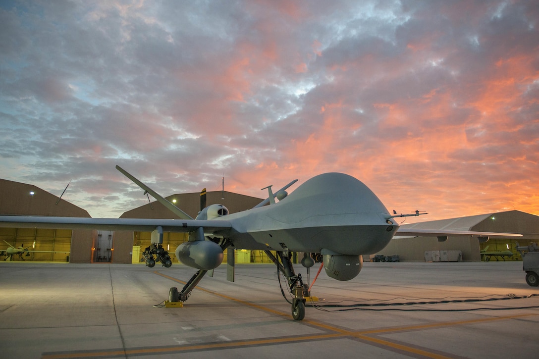 An MQ-9 Reaper equipped with an extended range modification sits on the ramp on Kandahar Airfield, Afghanistan, Dec. 6, 2015, before a sortie. U.S. Air Force photo by Tech. Sgt. Robert Cloys