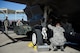 Weapons load crew members from the 61st Aircraft Maintenance Unit load an F-35 Lightning ll during the 4th quarter weapon's loading competition Dec. 18 at Luke Air Force Base, Ariz. This quarter featured the first time the F-35 was used in the competition against the F-16 Fighting Falcon at Luke. Three man crews from the 61st AMU, 309th AMU, 310th AMU, and the 425th AMU went head to head to earn this quarters win. (U.S. Air Force photo by Staff Sgt. Staci Miller)