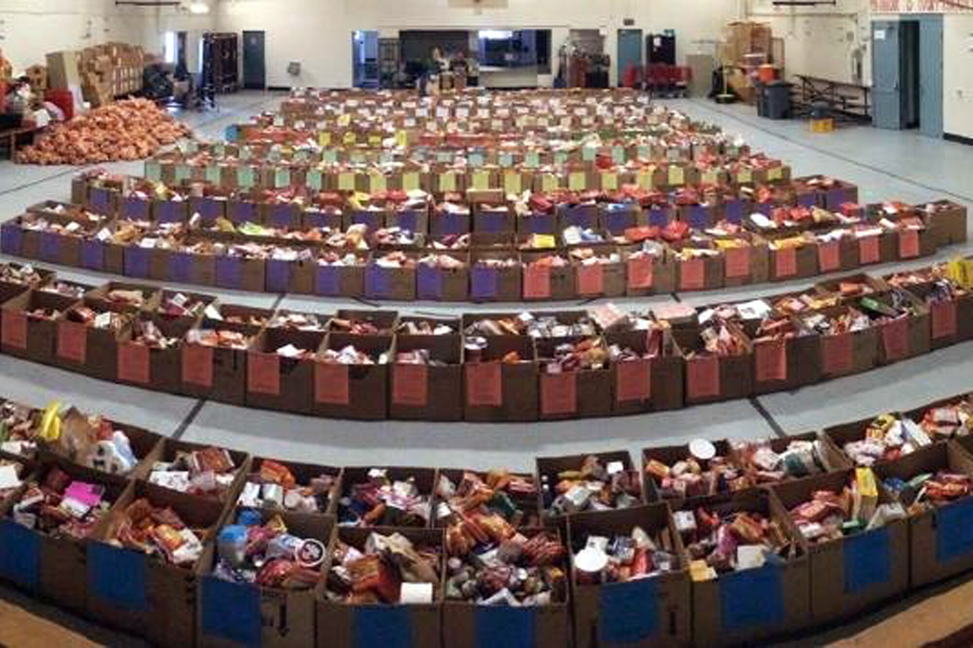 About 450 food boxes at the Central Pierce Fire & Rescue Department, Tacoma, Washington, wait to be delivered to local military families, Dec. 15, 2015. The department donated 50 of its 450 dinner boxes to the 446th Airlift Wing Care and Share program, run by the 446th Force Support Squadron, Airman & Family Readiness Center at Joint Base Lewis-McChord, Washington. Food drives are the cornerstone of Care and Share because they support Reserve families, who endure financial stress during the holiday season, said Mr. Carl Supplee, A&FRC director.