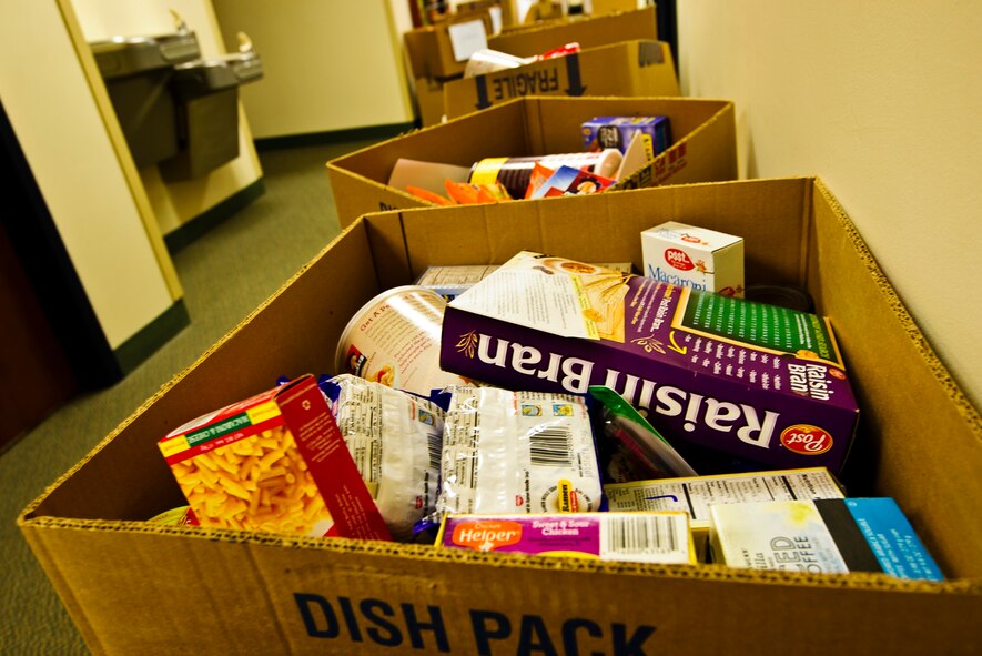 Rows of food boxes wait to be taken in by various Reserve family homes, Dec. 15, 2015. Food baskets for the December holidays are donated by the Central Pierce County Fire Department, Tacoma, Washington. The department donated 50 of its 450 dinner boxes to the 446th Airlift Wing Care and Share program, run by the 446th Force Support Squadron, Airman & Family Readiness Center here. Food drives are the cornerstone of Care and Share because they support Reserve families, who endure financial stress during the holiday season, said Mr. Carl Supplee, A&FRC director.