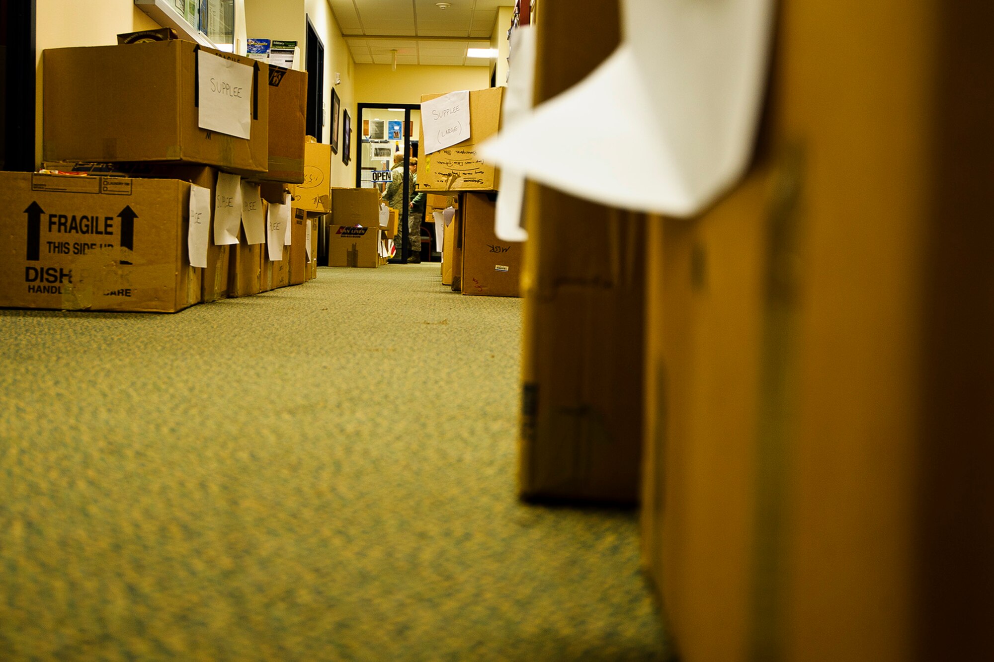 Rows of food boxes wait to be taken in by various Reserve family homes, Dec. 15, 2015. Food baskets for the December holidays are donated by the Central Pierce County Fire Department, Tacoma, Washington. The department donated 50 of its 450 dinner boxes to the 446th Airlift Wing Care and Share program, run by the 446th Force Support Squadron, Airman & Family Readiness Center here. Food drives are the cornerstone of Care and Share because they support Reserve families, who endure financial stress during the holiday season, said Mr. Carl Supplee, A&FRC director.