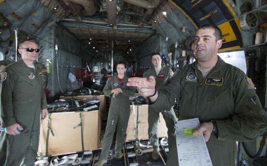 Maj. Lucas Crouch, 36th Airlift Squadron pilot, gives a pre-flight briefing at Andersen Air Force Base, Guam, Dec. 11, 2015, during Operation Christmas Drop. Every December, C-130H Hercules aircrews from Yokota head to Andersen Air Force Base to execute low-cost, low-altitude humanitarian airdrops to islanders throughout the Commonwealth of the Northern Marianas, Federated States of Micronesia, Republic of Palau. These islands are some of the most remote locations on the globe spanning a distance nearly as broad as the continental U.S. It is the longest-running Department of Defense humanitarian airdrop operation with 2015 being the first trilateral execution with support from Japan Air Self-Defense Force and Royal Australian Air Force. (U.S. Air Force photo by Osakabe Yasuo/Released)