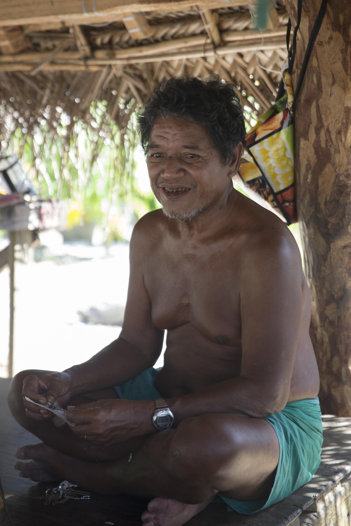 Louis Mangtau, Chief of Fais Island, talks at his house, Dec. 8, 2015, at Fais Island, Federated States of Micronesia. The Chief said, "I was kid, my father took me to the drop zone to watch U.S. aircraft dropped the box. That was so exciting moment. I still feel same when an aircraft flies over in this season." Operation Christmas Drop is a humanitarian/disaster relief training event where C-130 crews provide critical supplies to 56 islands throughout the Commonwealth of the Northern Marianas, Federated States of Micronesia and Republic of Palau. (U.S. Air Force photo by Osakabe Yasuo/Released)
