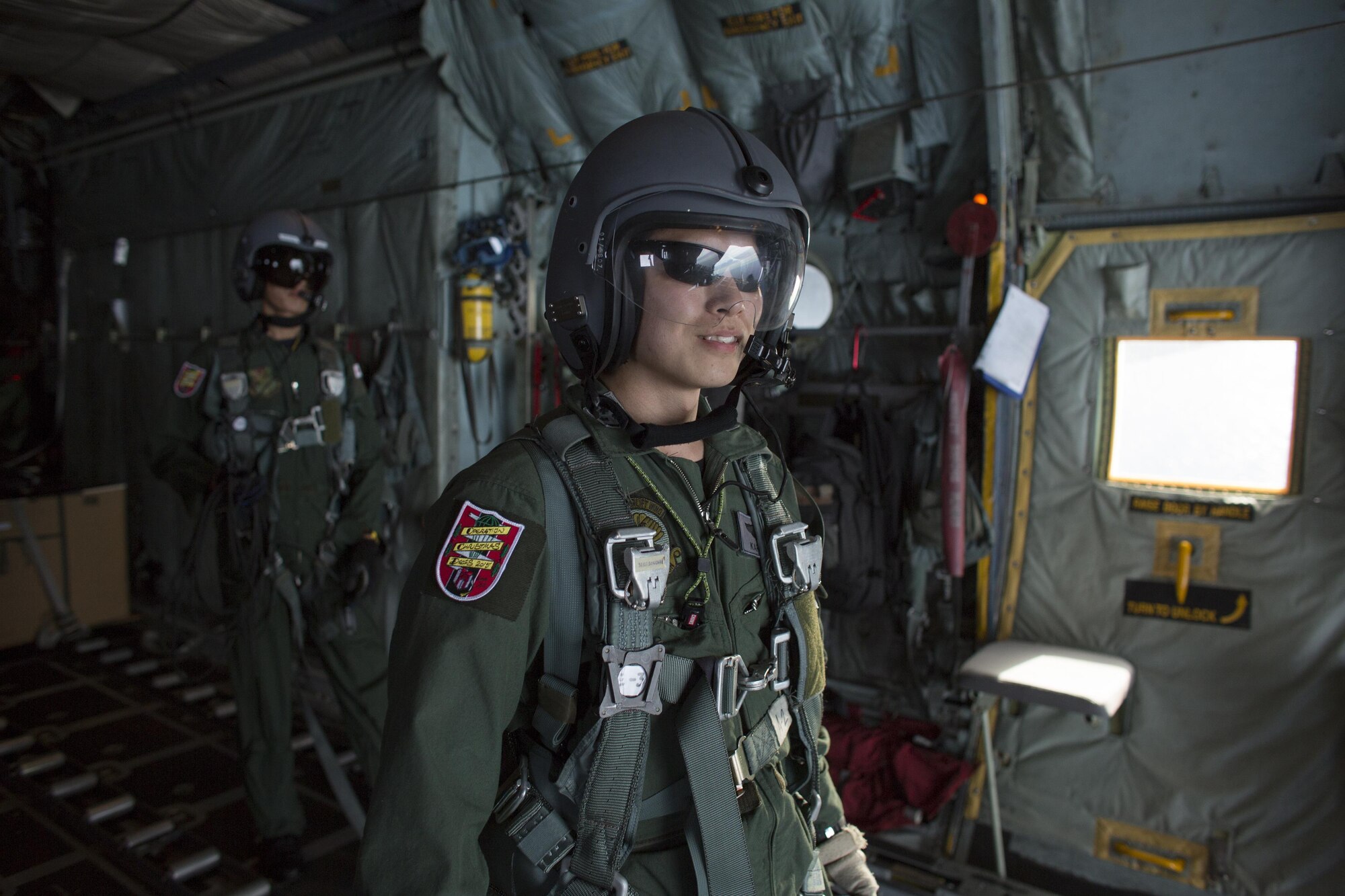 Japan Air Self-Defense Force Capt. Yusaku Kariya, 401st Squadron C-130 pilot, smiles after a successful airdrop missions over Lukunor Atoll, Federated States of Micronesia, Dec. 9, 2015, during Operation Christmas Drop. This year marks the 64th year of Operation Christmas Drop, which began in 1952, making it the world's longest-running airdrop mission. This is the first ever trilateral training event that includes additional air support from JASDF and Royal Australian Air Force C-130 aircrews. (U.S. Air Force photo by Osakabe Yasuo/Released)