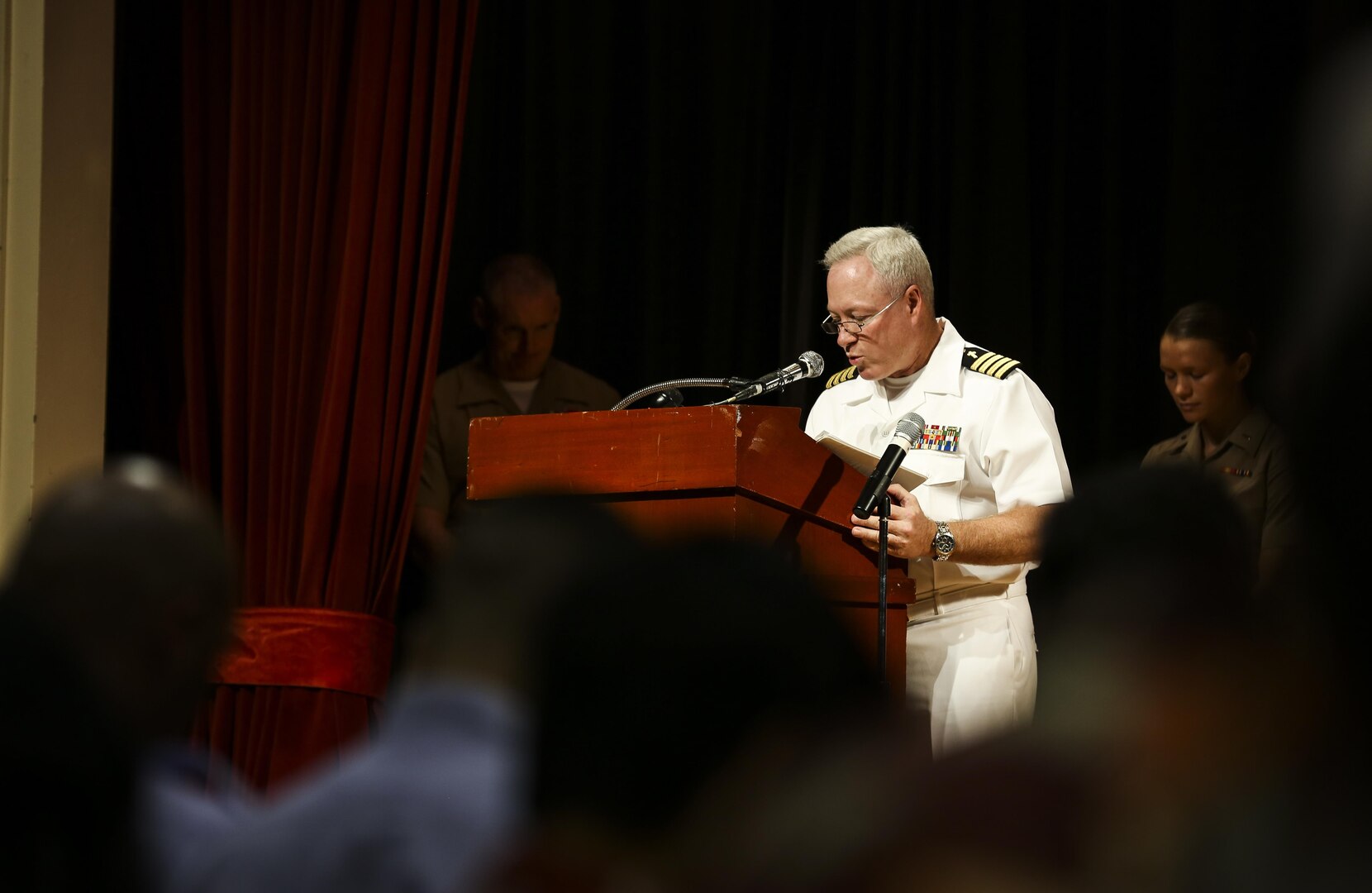 U.S. Navy Capt. Mark Hendricks, force chaplain, U.S. Marine Corps Forces, Pacific, gives the invocation during the First Responder Recognition Ceremony at the Neal S. Blaisdell Center, in Honolulu, Dec. 18, 2015. The first responders aided in the rescue and treatment of the crew and passengers of a 15th Marine Expeditionary Unit MV-22 Osprey tilt-rotor aircraft, which suffered a mishap at Marine Corps Training Area Bellows on May 2015.