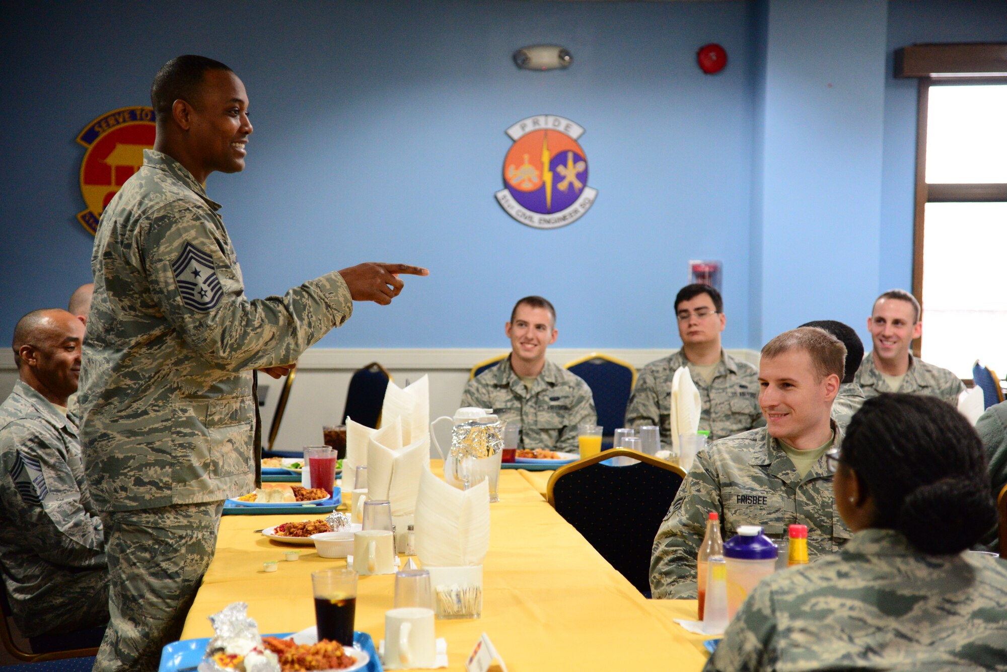 Seventh Air Force Command Chief Master Sgt. Anthony Johnson, mentors Airmen during a lunch break at the Pacific House dining facility on Osan Air Base, Republic of Korea, Dec. 10, 2015. Johnson shared stories and advice with the group during the first day of his immersion. (U.S. Air Force photo/Staff Sgt. Amber Grimm)
