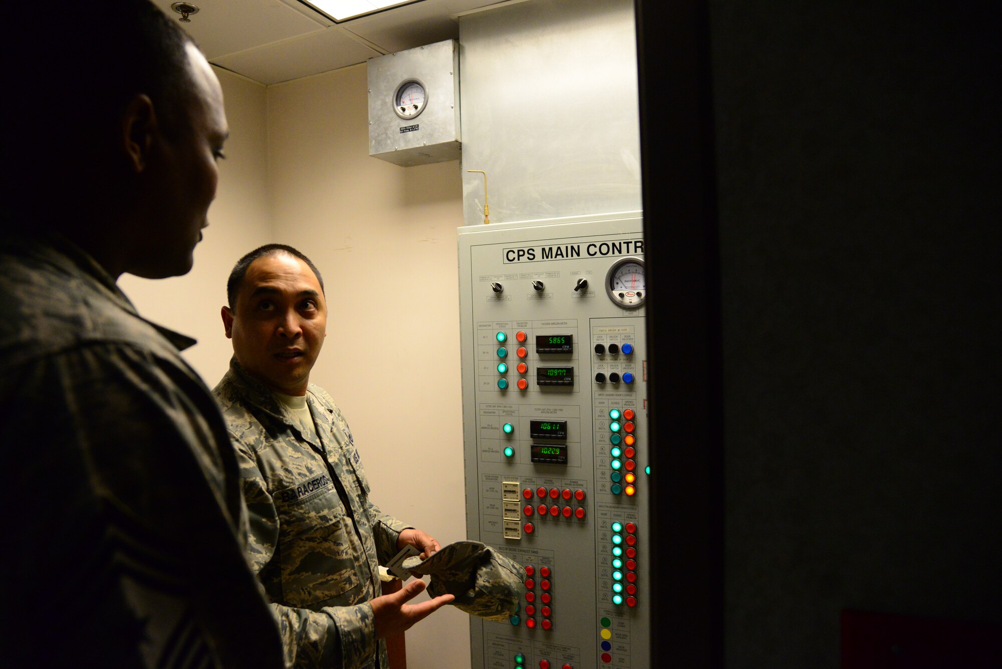 Tech. Sgt. Jason Baraceros, 51st Civil Engineer Squadron airman dormitory leader, demonstrates the collection protection system in building 1465 for Seventh Air Force Command Chief Master Sgt. Anthony Johnson, during his 51st Mission Support Group immersion at Osan Air Base, Republic of Korea, Dec. 10, 2015. The CPS dormitories ensure a chemical-free environment for personnel in the event of chemical, biological, radiological or nuclear threat. (U.S. Air Force photo/Staff Sgt. Amber Grimm)
