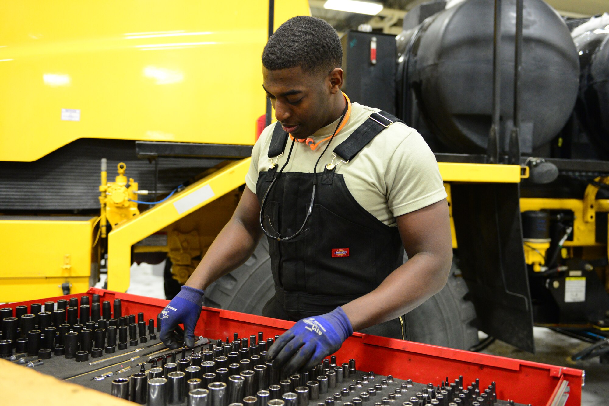 U.S. Air Force Senior Airman Dion Edwards, a 354th Logistics Readiness Squadron vehicular equipment maintenance mechanic, searches for a tool Dec. 16, 2015, at Eielson Air Force Base, Alaska. Edwards keeps his toolbox organized for ease of finding tools when he needs them. (U.S. Air Force photo by Airman 1st Class Cassandra Whitman/Released)