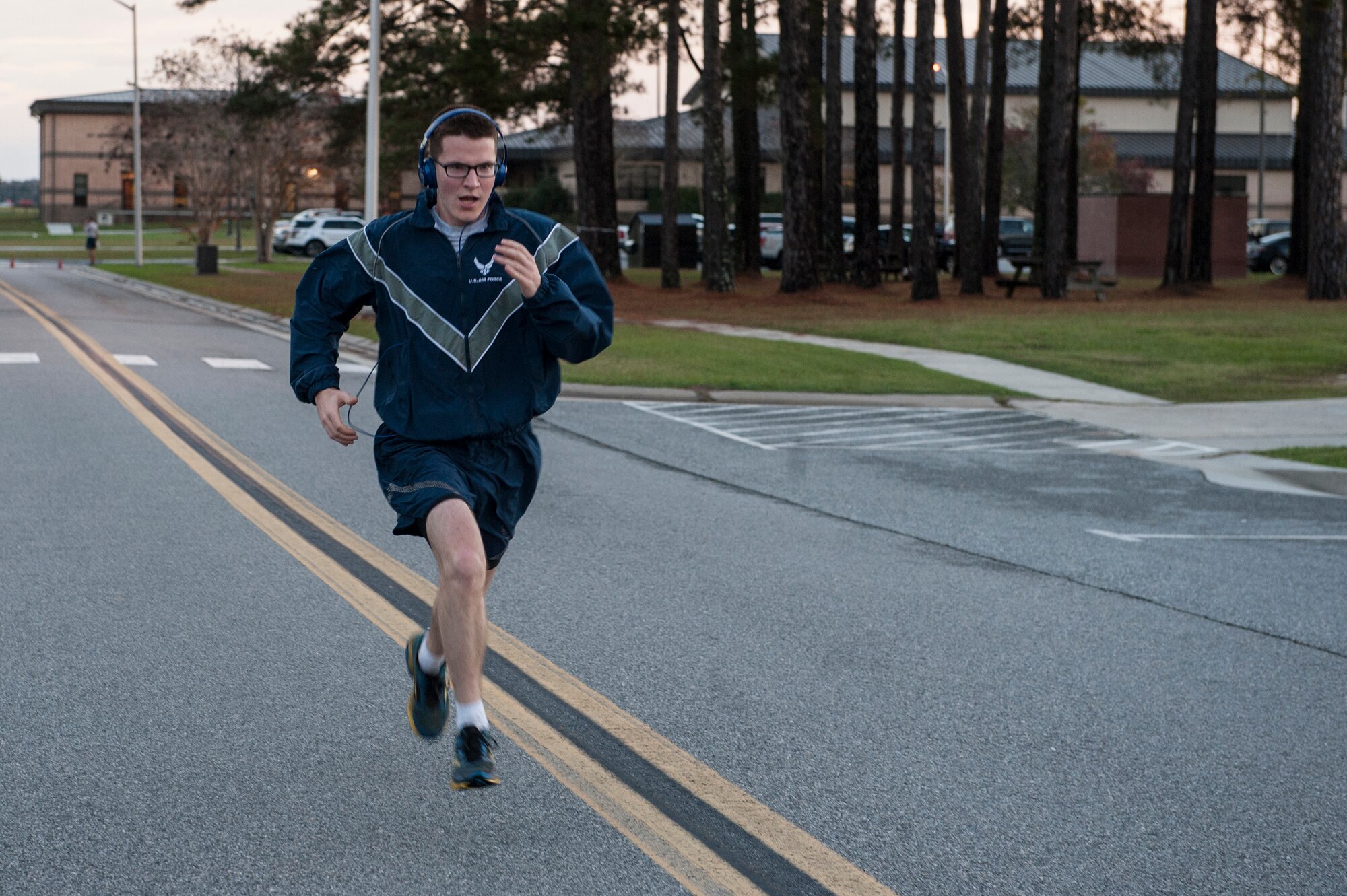 A Moody team-member sprints to the finish line of the Santa 5k, Dec. 18, 2015, at Moody Air Force Base, Ga. The fun run was used to boost morale and encourage Airmen to get out and run. (U.S. Air Force photo by Airman 1st Class Lauren Johnson/Released)