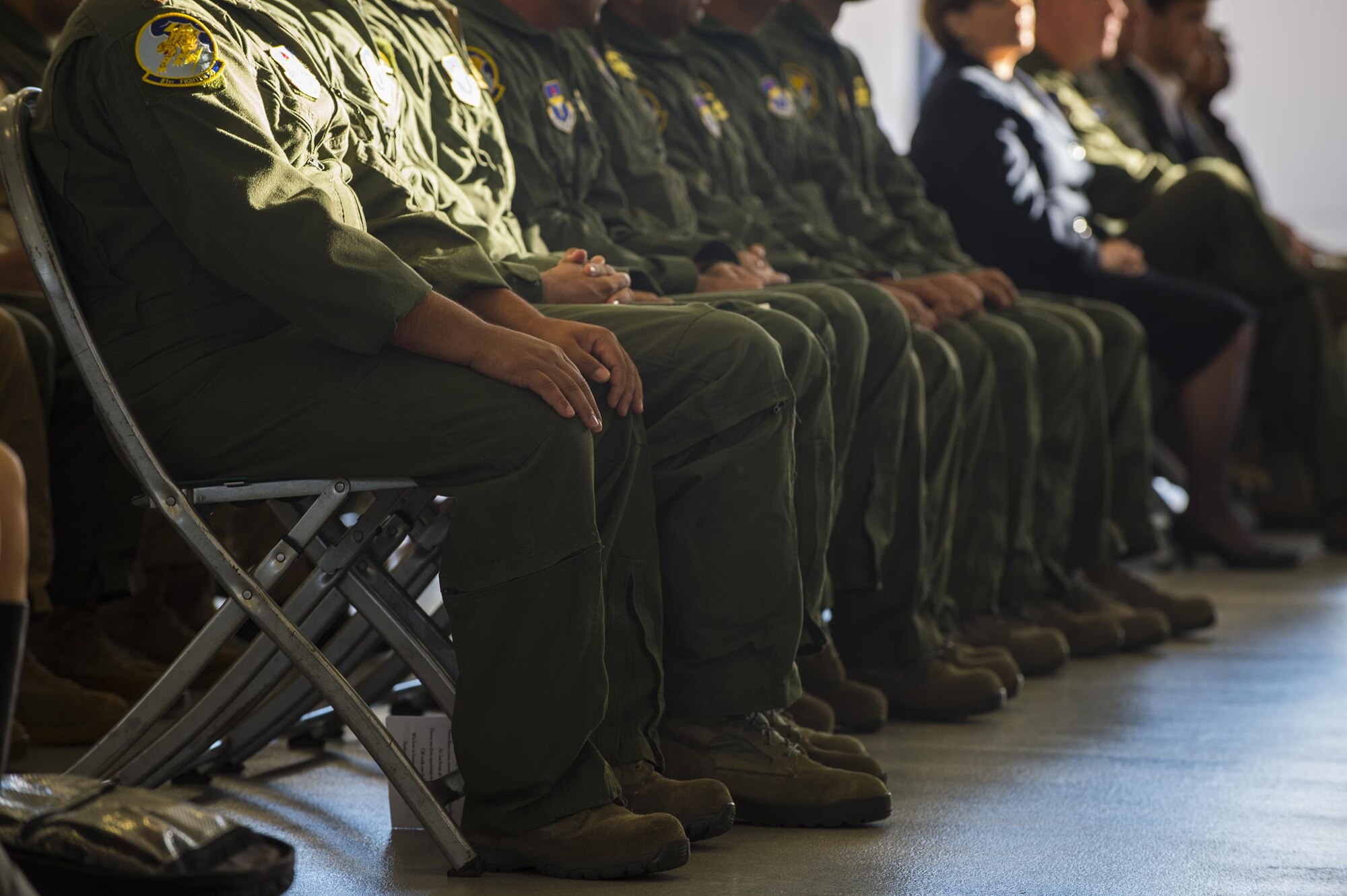 Afghan air force pilots await as their names are called during the graduation of the first 81st Fighter Squadron’s student pilot class, Dec. 18, 2015, at Moody Air Force Base, Ga. The 81st FS will train a total of 30 Afghan pilots and 90 Afghan maintainers over the next three years. (U.S. Air Force photo by Senior Airman Ceaira Tinsley/Released)