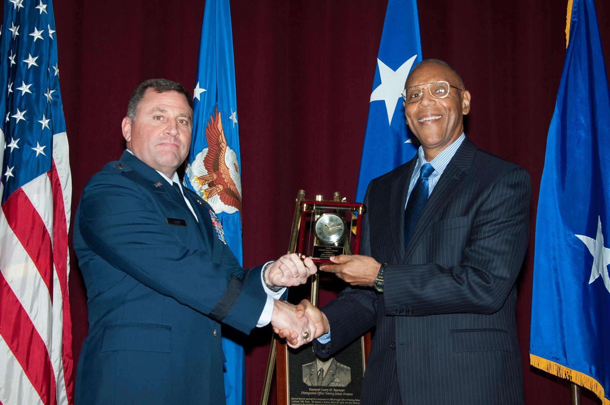 Maxwell AFB, Ala. -  Gen (Ret) Larry O. Spencer, former Vice Chief of Staff, USAF was honored at both  the Officer Training School (OTS)l and at the Enlisted Heritage Hall on Dec 17, 2015.  Gen Spencer was honored as a distinguished graduate of OTS and was added to the Wall of Achievers at the Enlisted Heritage Hall. Maj Gen Timothy Leahy, vice commander, Air University and Col Scott Lockwood, commandant, OTS officiated the distinguished graduate event.  (U.S. Air Force photo by Bud Hancock)