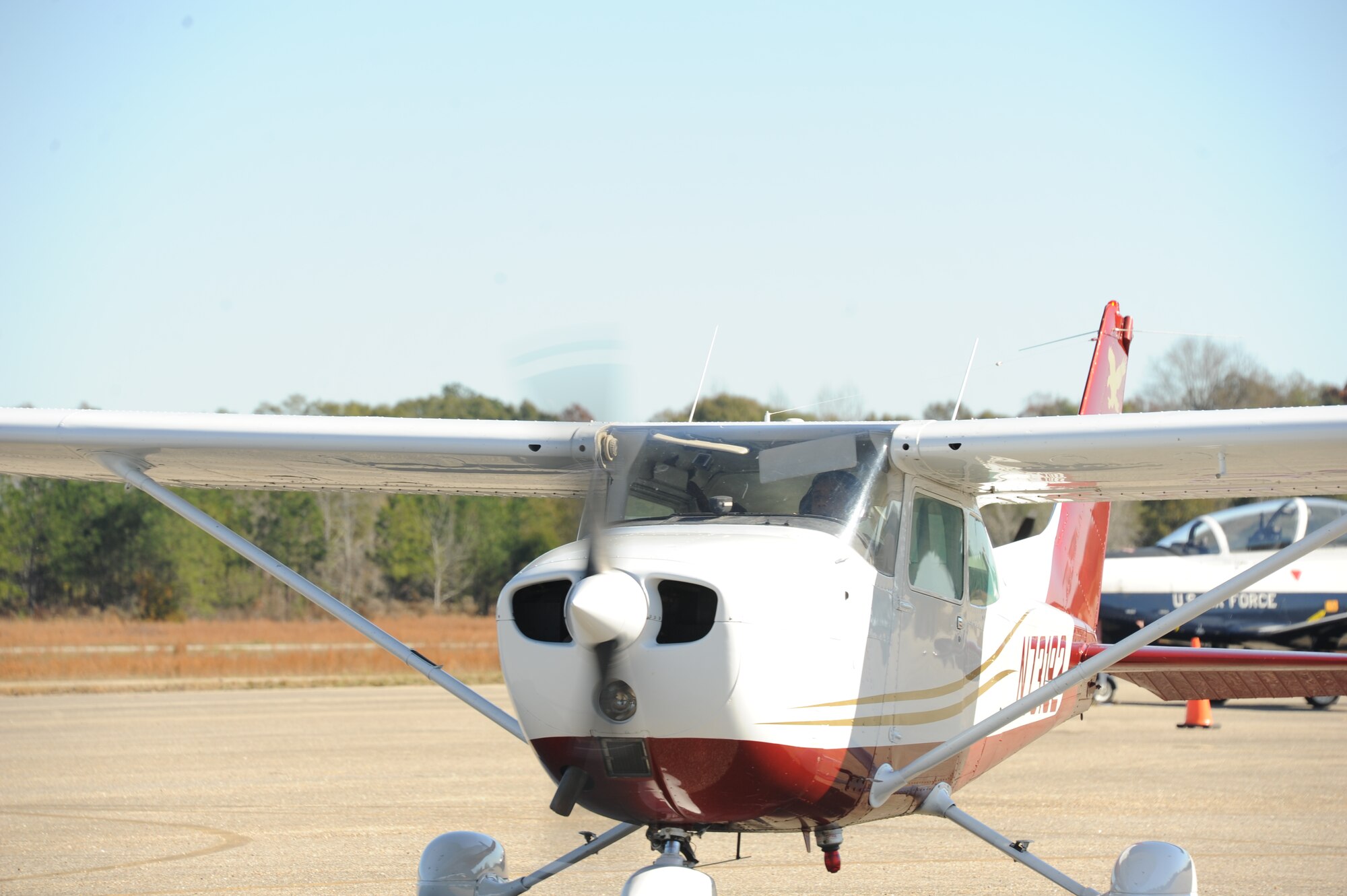 A Cessna 172 Sky Hawk arrives from an incentive flight during the Eyes Above the Horizon event Dec. 5, 2015, at the Tuskegee Institute National Historic Museum, Tuskegee, Alabama. Participants were educated on the history of the Tuskegee Airmen and the possibility of future careers in aviation before receiving 20 minute incentive flights with Air Force pilots. (U.S. Air Force photo by Airman 1st Class Alexa Culbert)