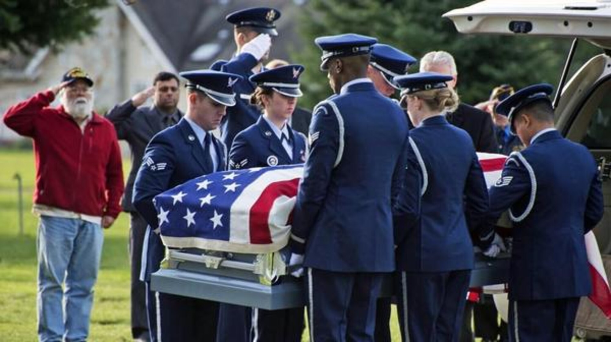 Airmen from the Joint Base Lewis-McChord Air Force Honor Guard lift the casket of 1st Lt. Joseph Moser from a hearse at his funeral Dec. 11 at Woodlawn Cemetery in Ferndale, Wash. (Air Force Photo/Senior Airman Jacob Jimenez)